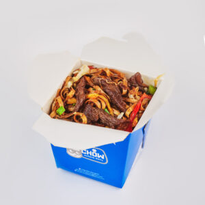 Flat noodles with veggies and protein wok tossed in a spicy soy sauce